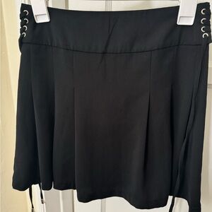 Black Pleated Mini Skirt with Side Lace-Up Detail